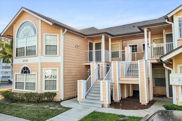 view of property featuring stairs