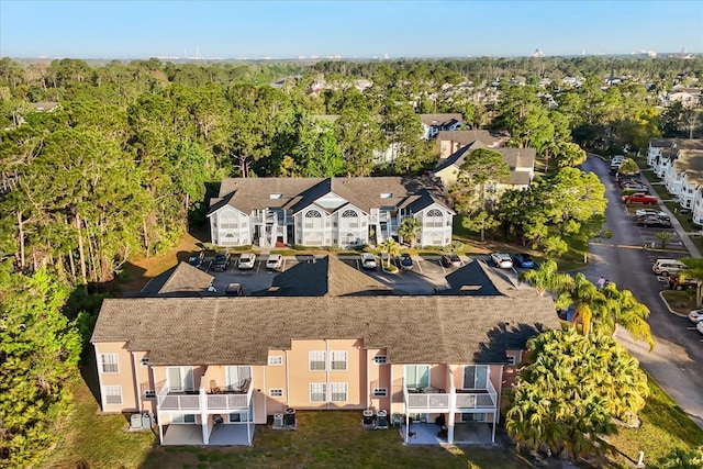 aerial view with a residential view and a view of trees