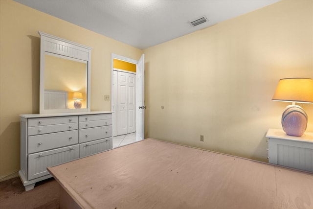 bedroom featuring visible vents