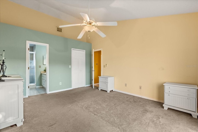 unfurnished bedroom with visible vents, baseboards, ceiling fan, carpet flooring, and ensuite bathroom