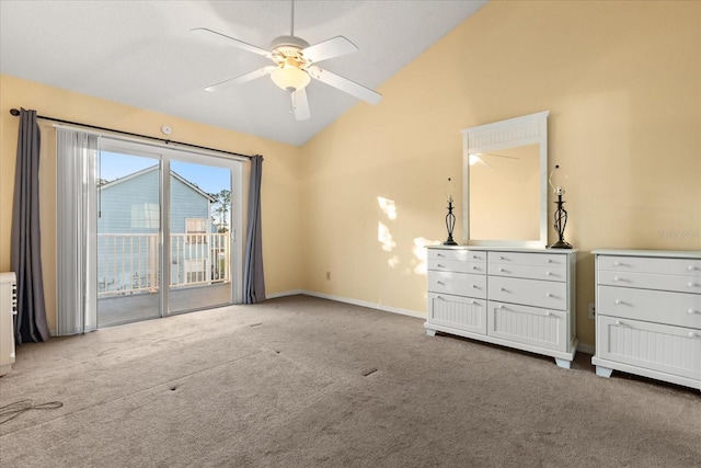 unfurnished bedroom featuring a ceiling fan, access to outside, carpet, baseboards, and vaulted ceiling