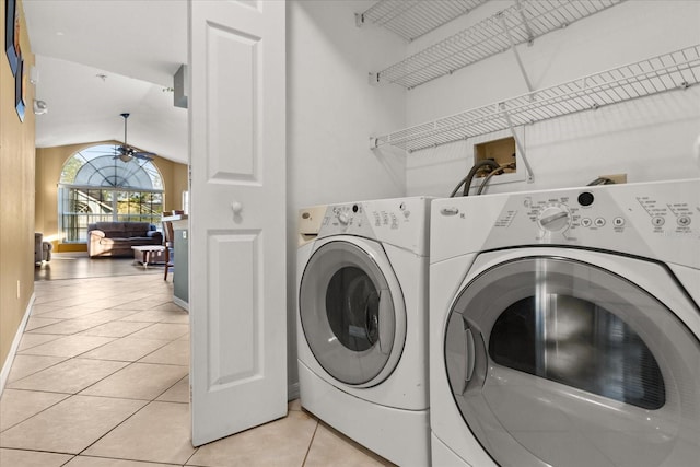 laundry room with a ceiling fan, baseboards, laundry area, light tile patterned flooring, and washer and dryer