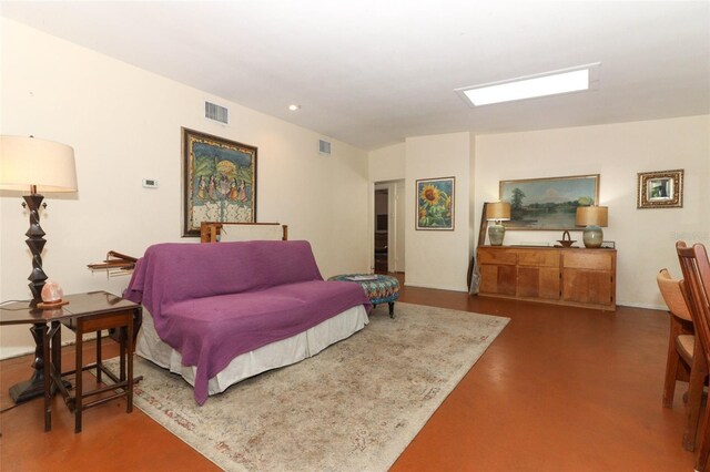 bedroom with concrete floors, visible vents, and recessed lighting