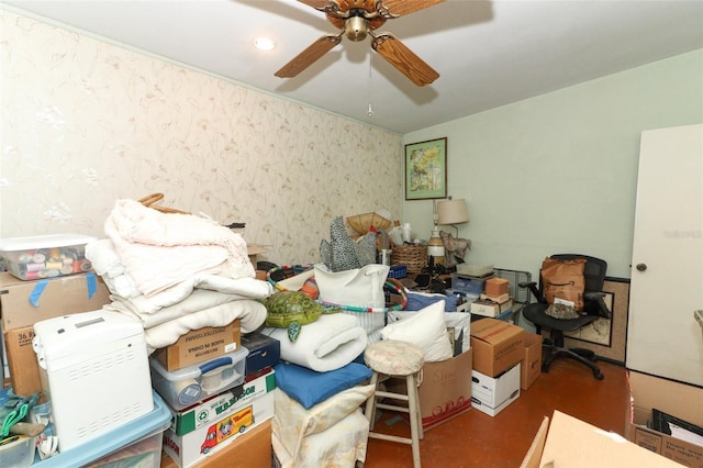 interior space featuring concrete floors, wallpapered walls, and ceiling fan