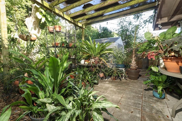 view of patio featuring a pergola and fence