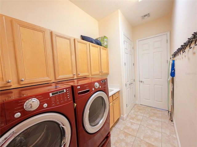 9137 Southern Breeze Dr, Orlando, FL 32836 - laundry room featuring cabinet space, baseboards, light tile patterned floors, visible vents, and washing machine and dryer