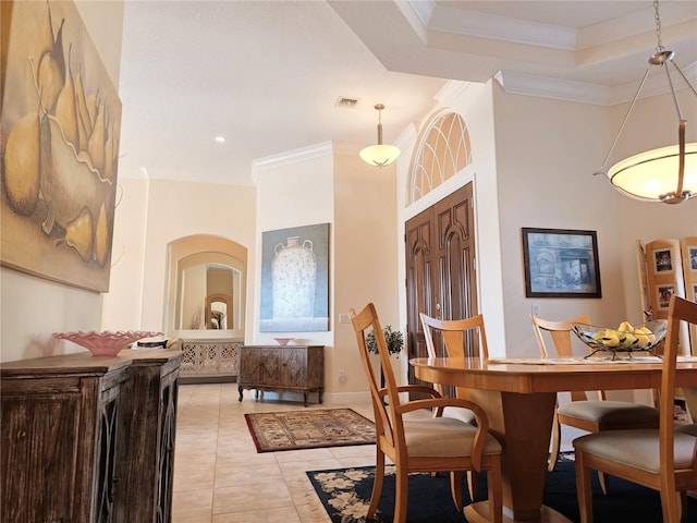 9137 Southern Breeze Dr, Orlando, FL 32836 - dining space featuring light tile patterned flooring, baseboards, visible vents, and ornamental molding