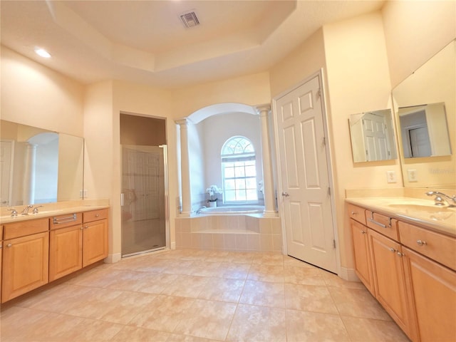 9137 Southern Breeze Dr, Orlando, FL 32836 - bathroom featuring decorative columns, a bath, visible vents, a shower stall, and a sink