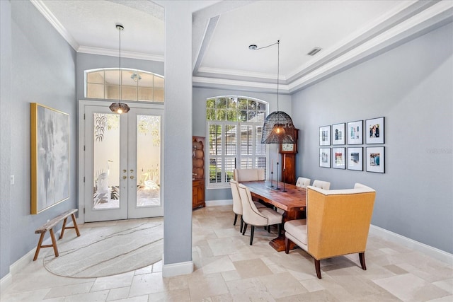 interior space with visible vents, french doors, baseboards, and ornamental molding