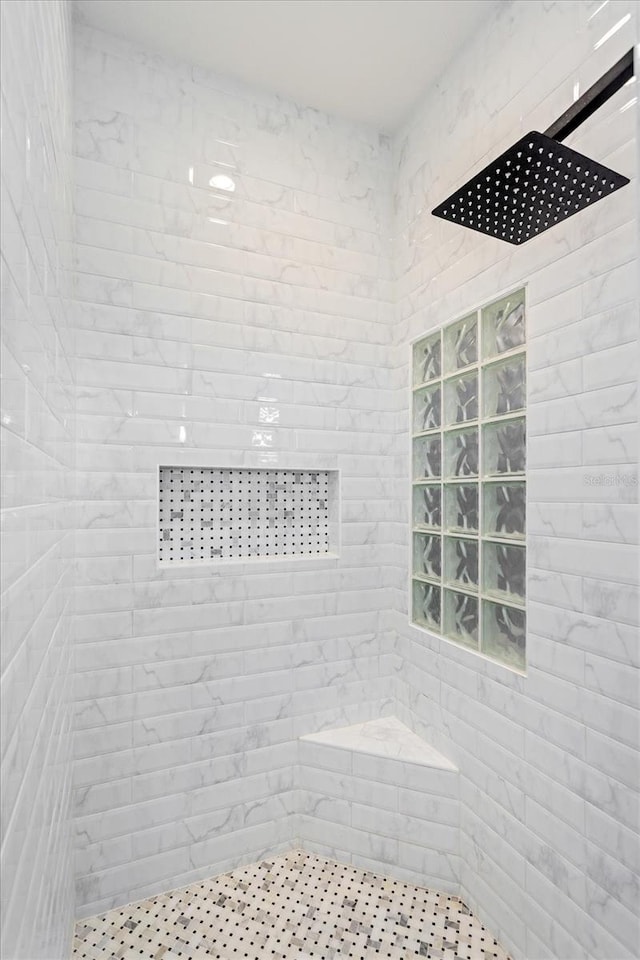 bathroom featuring tiled shower