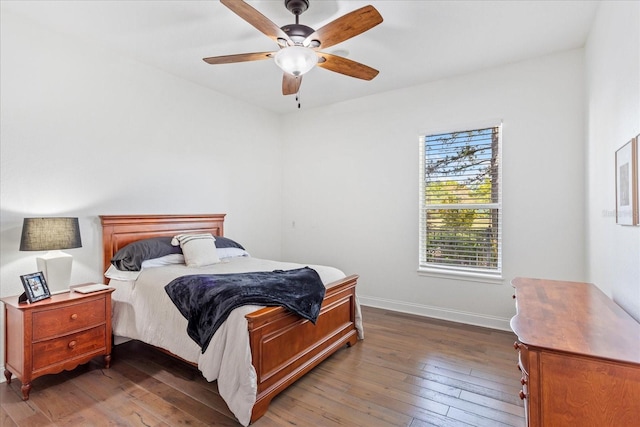 bedroom featuring hardwood / wood-style floors, baseboards, and ceiling fan