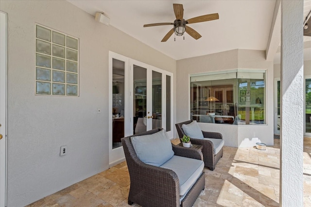 view of patio with french doors and ceiling fan