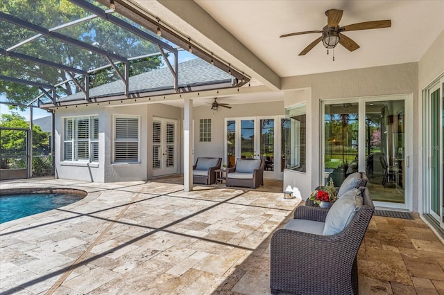 view of patio / terrace featuring glass enclosure, french doors, an outdoor pool, and ceiling fan