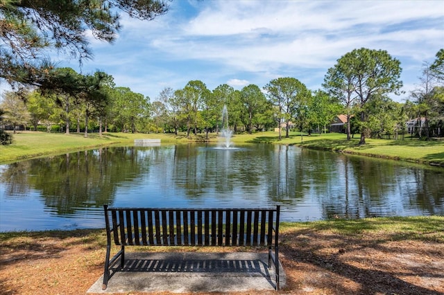 surrounding community with a water view