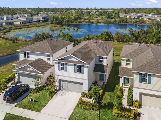 birds eye view of property featuring a residential view and a water view