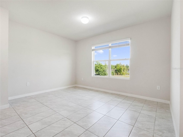 empty room featuring baseboards