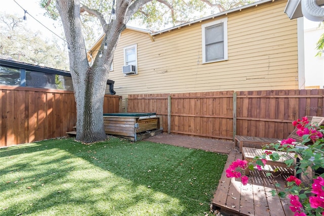 view of yard featuring cooling unit and a fenced backyard