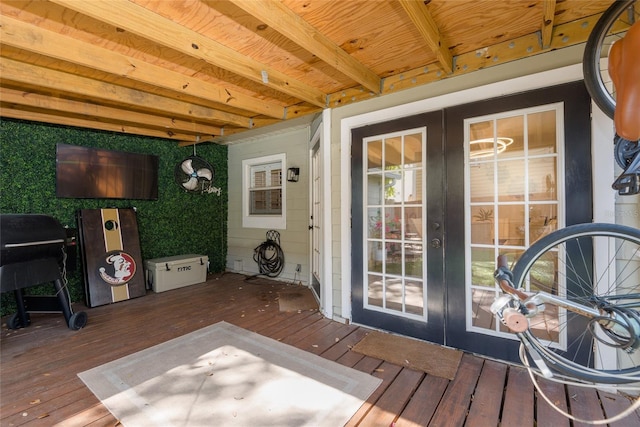 wooden deck featuring french doors