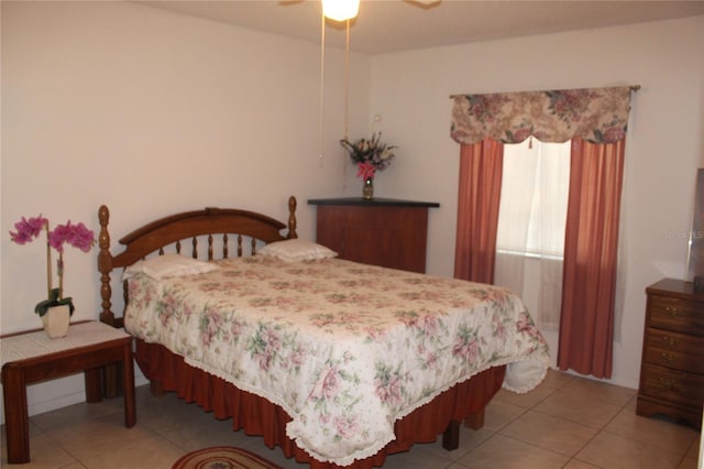 bedroom with light tile patterned floors and ceiling fan