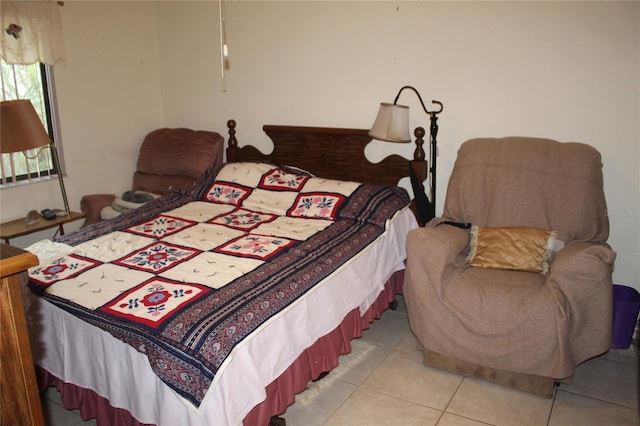 bedroom featuring light tile patterned flooring