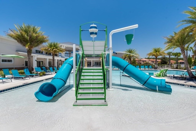 community playground featuring a community pool