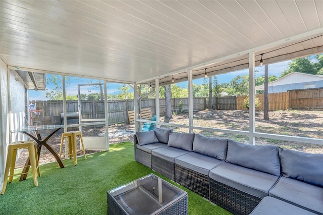 sunroom / solarium featuring an outdoor living space