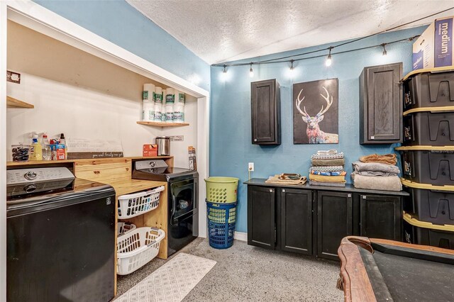 kitchen featuring a textured ceiling, open shelves, light speckled floor, and washer / dryer