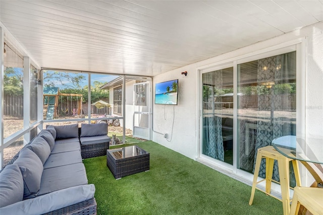 sunroom / solarium featuring an outdoor living space