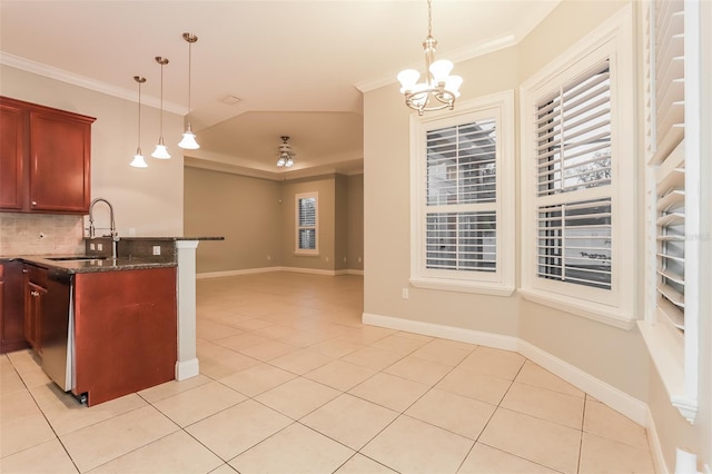 kitchen featuring a sink, a notable chandelier, light tile patterned flooring, and crown molding