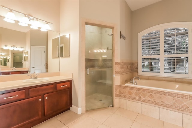 full bath with a garden tub, a stall shower, vanity, and tile patterned flooring