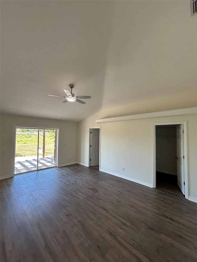 unfurnished living room featuring dark wood-style floors, baseboards, lofted ceiling, and ceiling fan