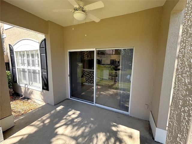 view of patio with ceiling fan