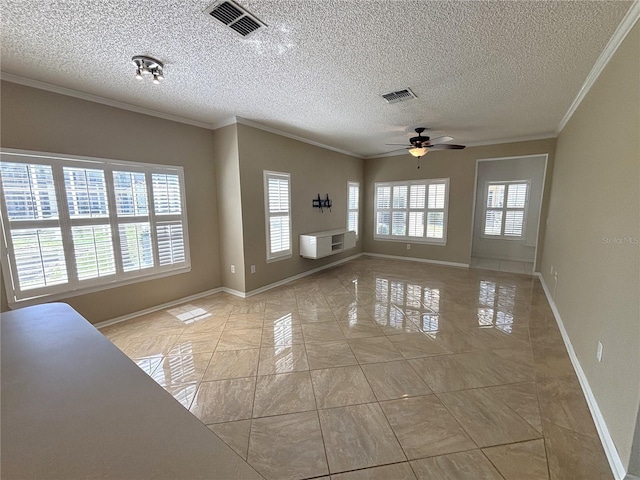 unfurnished living room featuring crown molding, baseboards, visible vents, and ceiling fan