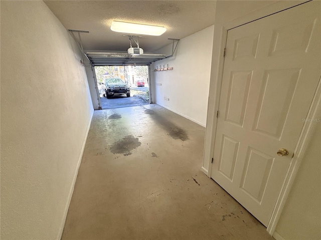 garage featuring baseboards