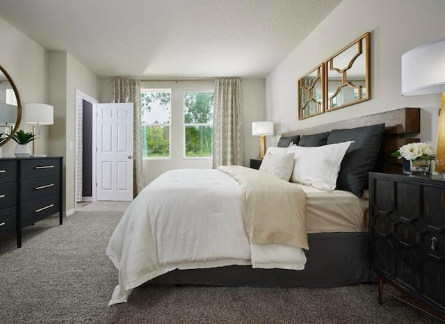 bedroom featuring baseboards, a textured ceiling, and carpet flooring