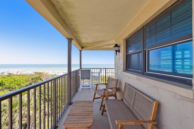 balcony featuring a water view