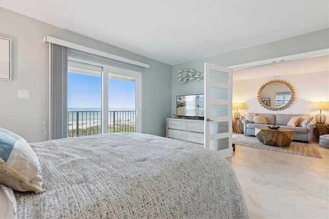 bedroom featuring marble finish floor and access to outside