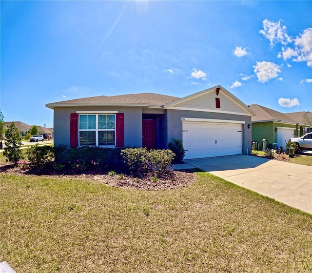 ranch-style house featuring a garage, driveway, and a front yard