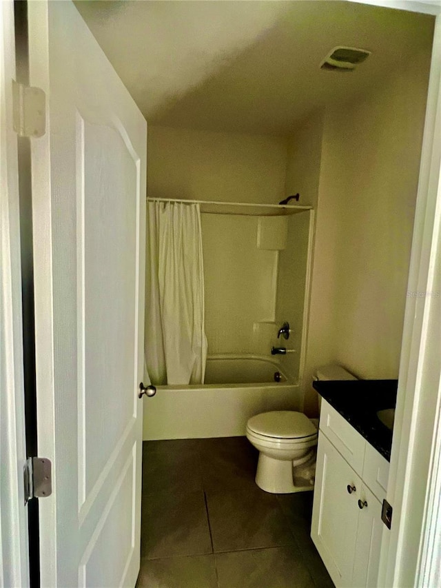 bathroom with visible vents, toilet, shower / bath combo, tile patterned flooring, and vanity