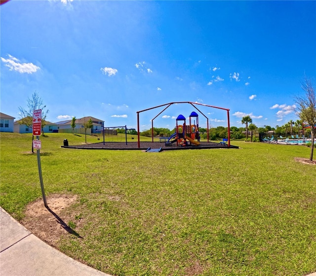 communal playground featuring a yard