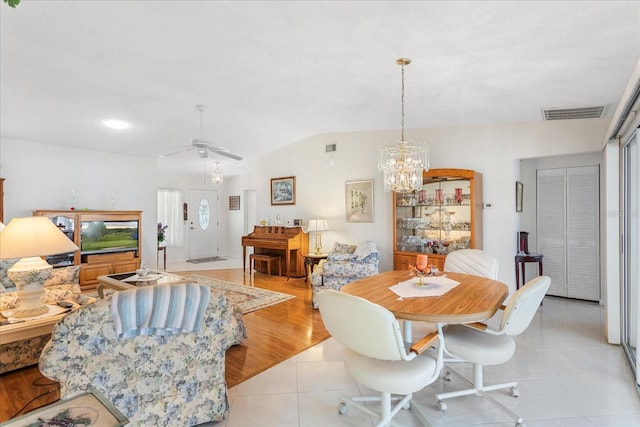 3748 Innisbrook Dr, Lakeland, FL 33810 - dining room with a chandelier, light tile patterned floors, a ceiling fan, and lofted ceiling