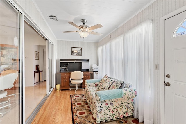 3748 Innisbrook Dr, Lakeland, FL 33810 - sitting room featuring wallpapered walls, crown molding, a ceiling fan, light wood-style flooring, and an office area