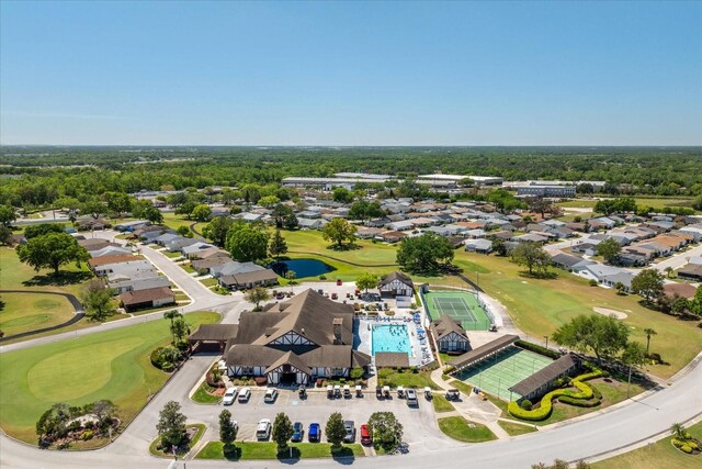 3748 Innisbrook Dr, Lakeland, FL 33810 - aerial perspective of suburban area featuring a golf course, a nearby body of water, and a pool