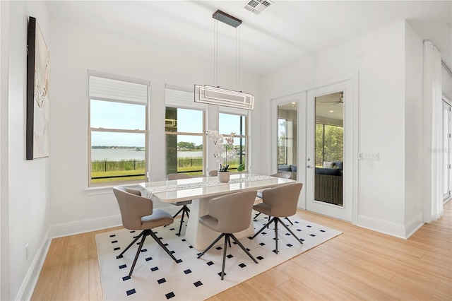 16689 Broadwater Ave, Winter Garden, FL 34787 - dining area featuring light wood-style floors, visible vents, and baseboards