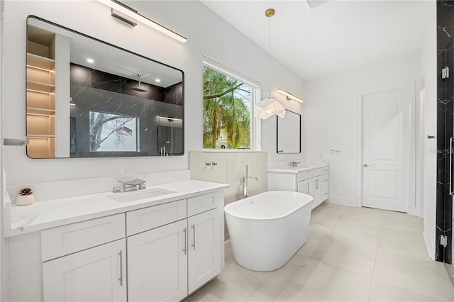 16689 Broadwater Ave, Winter Garden, FL 34787 - bathroom featuring two vanities, a soaking tub, a sink, and a stall shower