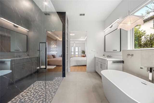 16689 Broadwater Ave, Winter Garden, FL 34787 - ensuite bathroom with a freestanding tub, visible vents, connected bathroom, and a healthy amount of sunlight