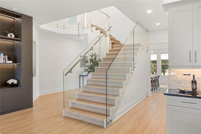 16689 Broadwater Ave, Winter Garden, FL 34787 - staircase with baseboards, wood finished floors, and recessed lighting
