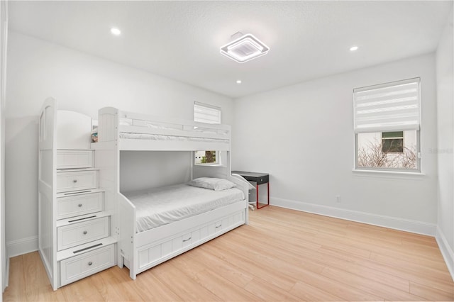16689 Broadwater Ave, Winter Garden, FL 34787 - bedroom with baseboards, light wood-style floors, and recessed lighting