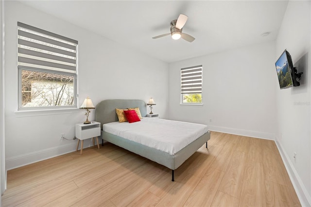 16689 Broadwater Ave, Winter Garden, FL 34787 - bedroom featuring light wood-type flooring, a ceiling fan, and baseboards