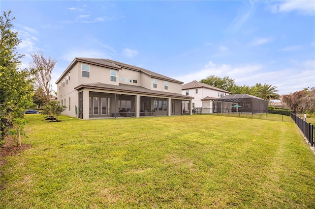16689 Broadwater Ave, Winter Garden, FL 34787 - back of house featuring a fenced backyard, a sunroom, a yard, and stucco siding